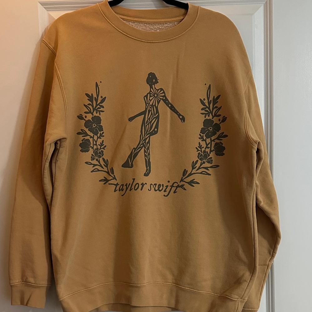 Taylor Swift “still on that tightrope" folklore pullover